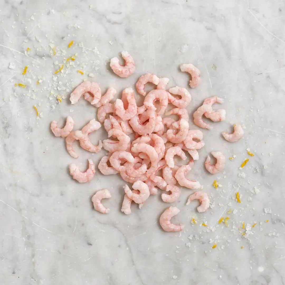 Raw shrimp on a marble surface